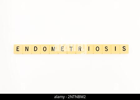 ENDOMETRIOSIS word written with plastic game tiles. Alphabet letters for a gynecological painful disorder awareness. Menstruation, women's health. Stock Photo