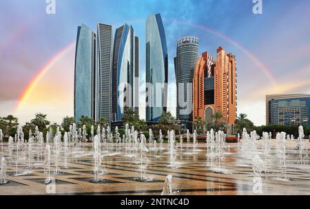 Rainbow over Abu Dhabi Skyline at sunset, United Arab Emirates Stock Photo