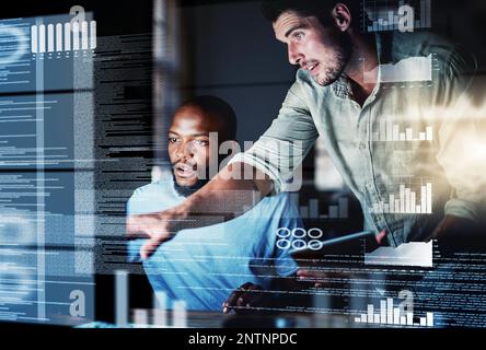 Lets test this algorithm. Shot of two programmers working together on a computer code at night. Stock Photo