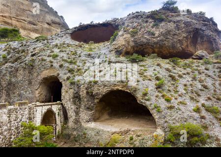 Cave with entrance bridge to El Caminito del Rey in El Chorro Spain Stock Photo