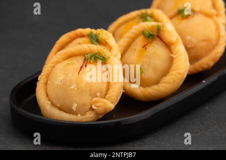 Chandrakala Gujia Mithai Also Called Suryakala Gujiya, Pirukiya, Pirukia, Pedakiya, Karanji, Basundi Gughra Made Of Suji Ghee Stuffed With Mawa Khoya Stock Photo