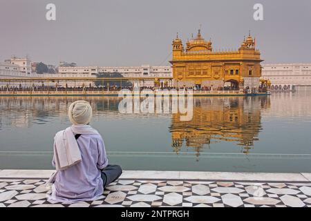 pilgrim and sacred pool Amrit Sarovar, Golden temple, Amritsar, Punjab, India Stock Photo