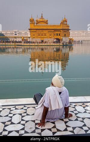 pilgrim and sacred pool Amrit Sarovar, Golden temple, Amritsar, Punjab, India Stock Photo