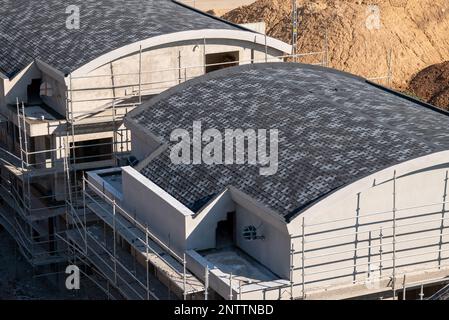 Shingle covered on the roof of a newly built residential building Stock Photo