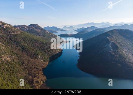 Aerial view of Skadar Lake National park panoramic vibrant landscape, Montenegro, Skadarsko jezero, also called Shkodra or Scutari, with mountains in Stock Photo