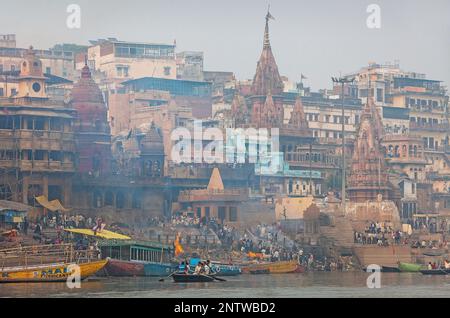 Manikarnika Ghat, the burning ghat, on the banks of Ganges river, Varanasi, Uttar Pradesh, India. Stock Photo