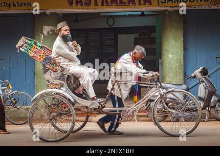 Rickshaw, in Godowlia Road, downtown, Varanasi, Uttar Pradesh, India. Stock Photo