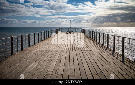 A view down Bognor Regis Pier in West Sussex, UK, looking out across the English Channel. Stock Photo