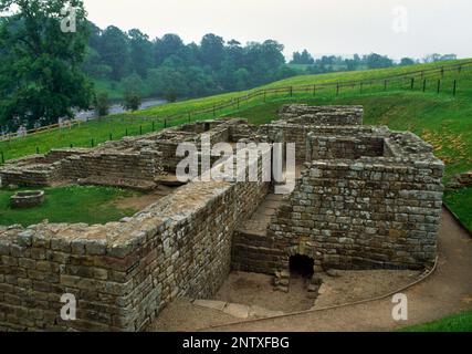 Roman bath house outside the E wall of Chesters Roman fort, Hadrian's Wall, Northumberland, England, UK, looking S with River North Tyne to L (E). Stock Photo