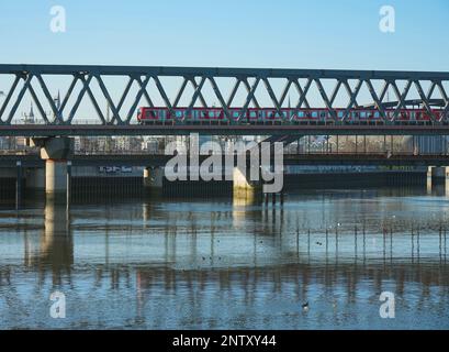 Hamburg, Germany. 06th Feb, 2023. A commuter train runs on a bridge over the water of Billhafen. Credit: Soeren Stache/dpa/Alamy Live News Stock Photo