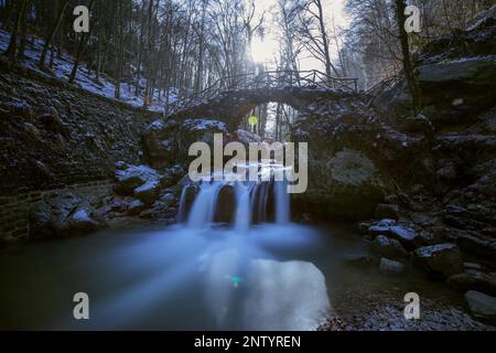 Europe, Luxembourg, Mullerthal, The Schiessentümpel Waterfall in Wintertime Stock Photo
