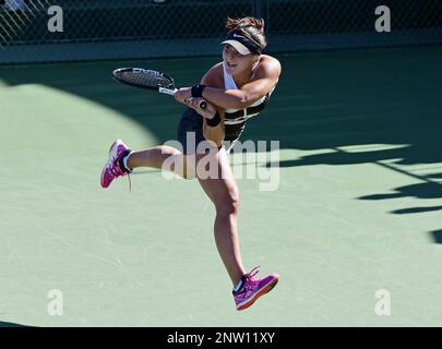 NEWPORT BEACH, CA - JANUARY 27: Jil Teichmann (SUI) and Misaki Doi (JPN)  hold there doubles championship trophies after defeating the doubles team  of Jamie Loeb (USA) and Rebecca Peterson (SWE) in