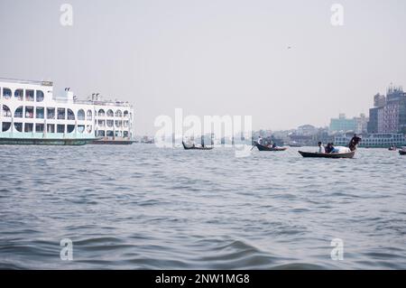 A view of buriganga river where people are traveling by boat in Dhaka, Bangladesh. Stock Photo