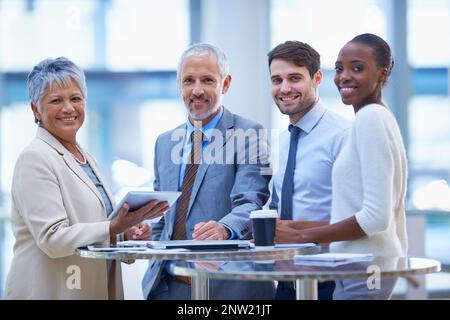 Our strategy works. Portrait of a group of diverse businesspeople having a meeting at the office. Stock Photo