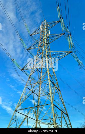 Electricity high voltage cables and pylons. Stock Photo