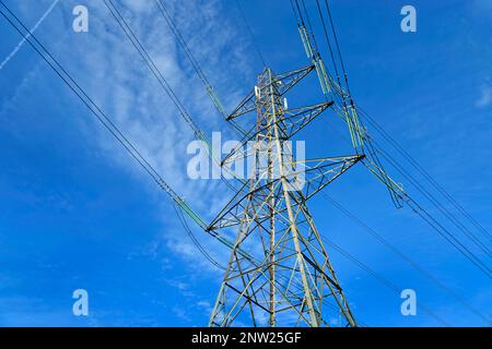 Electricity high voltage cables and pylons. Stock Photo