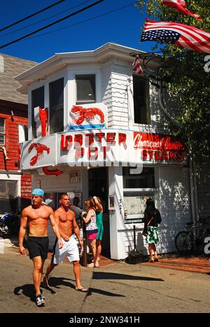 Two men enjoy the summer weather strolling through Provincetown, on Cape Cod Stock Photo