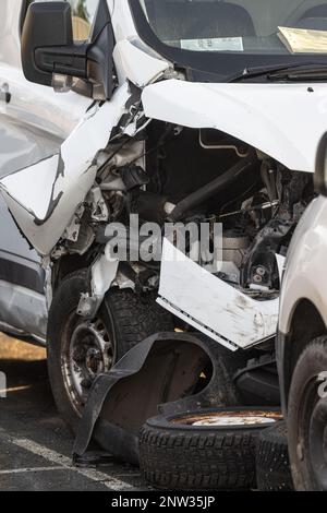 Front of a crashed white van Stock Photo