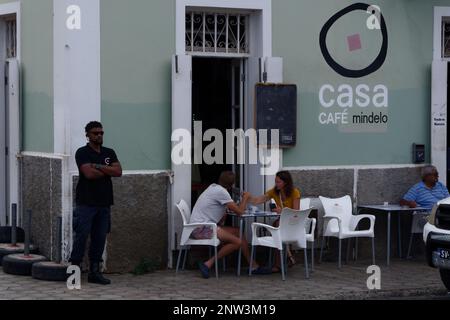 Porto Grande, Cape Verde Islands - a couple enjoy the fine weather and their coffee at an attractive sidewalk cafe in Porto Grande. Stock Photo