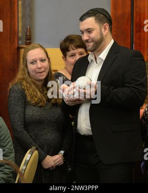 In this Dec. 27, 2018, photo, parents Avrah and David Leven hold