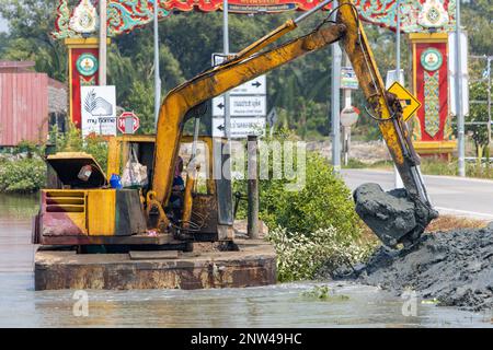 SAMUT PRAKAN, THAILAND, FEB 23 2023, A floating dredger is dredging the bottom of the pond, Thailand Stock Photo