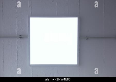 LED ceiling light mounted in an industrial space Stock Photo