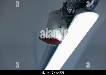Socket suspended on the technical ceiling with three-phase current Stock Photo