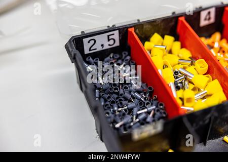 A close up of a tool box with a lot of different electrical pins Stock Photo