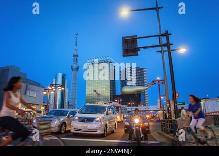 Crosswalk in Kaminarimon street, in background Sky Tree and Asahi building, Asakusa District, Tokyo, Japan Stock Photo