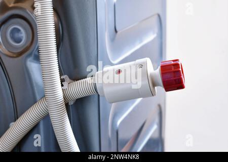 Unplugged washing machine hose Stock Photo