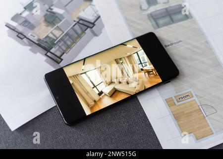 website wireframe sketch and programming code on smartphone Stock Photo