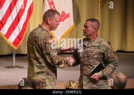 Maj. Gen. Kenneth Kamper, Fires Center of Excellence and Fort Sill commanding general congratulating Brig. Gen. Thomas Moore, outgoing deputy commanding general, Army National Guard, Air Defense Artillery, at the retreat ceremony. Stock Photo