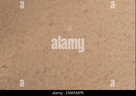 Dry recycled beige color paper background macro close up view Stock Photo
