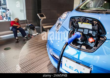 Homeless sleeping in The Nissan Gallery, located in  Ginza 4 Chome intersection .Tokyo city, Japan, Asia Stock Photo