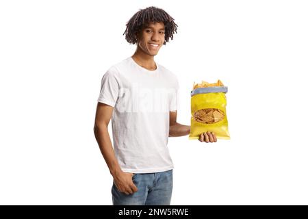 Young african american man holding a pack of tortilla chips isolated on white background Stock Photo