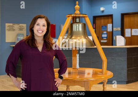 NAVAL STATION ROTA, Spain (January 20, 2023)  Monica Gonzalez, command ombudsman for Naval Station (NAVSTA) Rota, poses for a photo in the front of the command building, Jan. 20 2023. Stock Photo