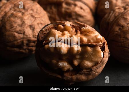 walnuts on black slate background Stock Photo