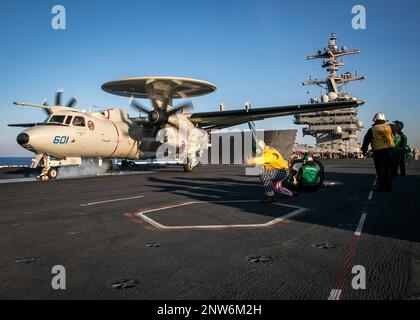 230220-N-EL850-4025 ADRIATIC SEA (Feb. 20, 2023) Lt. Cmdr. Christopher Baker, assigned to the Nimitz-class aircraft carrier USS George H.W. Bush (CVN 77), launches an E-2D Hawkeye, attached to Carrier Airborne Early Warning Squadron (VAW) 121, off of the flight deck during flight operations, Feb. 20, 2023. Carrier Air Wing (CVW) 7 is the offensive air and strike component of Carrier Strike Group (CSG) 10 and the George H.W. Bush CSG. The squadrons of CVW-7 are Strike Fighter Squadron (VFA) 143, VFA-103, VFA-86, VFA-136, Carrier Airborne Early Warning Squadron (VAW) 121, Electronic Attack Squad Stock Photo