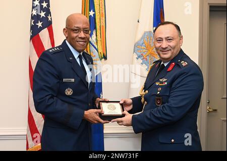 Chief of Staff of the Air Force Gen. CQ Brown, Jr., presents a gift to Turkish Defense Attache Brig. Gen. Hakan Canlie after an office call in the Pentagon, Arlington, Va., Jan 17, 2023. Stock Photo