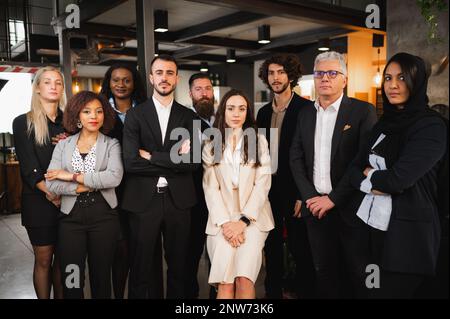 Elegant portrait of formal businesspeople looking at camera with serious face. Stock Photo