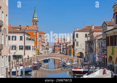 Bridge over canal Vena at Chioggia, coastal town on small island at southern entrance to the Venetian Lagoon near Venice, Veneto, Northern Italy Stock Photo