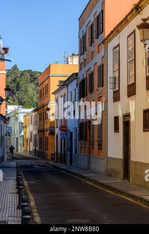 A row of colourful buildings lines the narrow Calle Bencomo in San Cristobal de la Laguna in Tenerife. Stock Photo