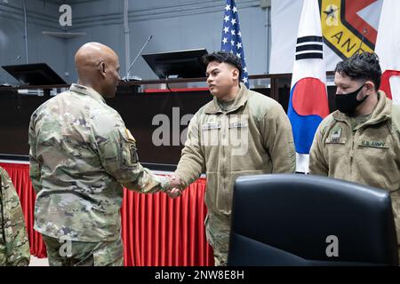 Lieutenant General Willard M. Burleson III, Commanding General, Eighth Army, presented Pfc. Nick B. Heuangpraseuth of HHD, 41st Signal Battalion, with an 8th Army Coin of Excellence this morning. Major General Joseph D'costa, Deputy Commanding General of Sustainment, Eighth Army, also presented him another coin.    Pfc. Heuangpraseuth's effort in establishing communication security devices and accompanying equipment that enables mobile communication capabilities is exceptional.    U.S. Army Photo by: Sgt. Alex Estrada Stock Photo