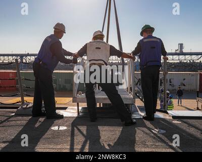 230101-N-UL352-1005 FUJAIRAH, United Arab Emirates (Jan. 1, 2023) Sailors assigned to guided-missile destroyer USS Delbert D. Black (DDG 119) set the brow during a port visit to Fujairah, United Arab Emirates, Jan. 1. Delbert D. Black is deployed to the U.S. 5th Fleet area of operations to help ensure maritime security and stability in the Middle East region. Stock Photo