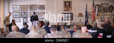 Illinois Army National Guard Chaplain (Lt. Col.) Vince Lambert speaks at his promotion ceremony in Memorial Hall in the Illinois Army National Guard's historic General Richard L. Jones Armory on Chicago's South Side. Chaplain Lambert, of Evergreen Park, Illinois, spent nearly two decades in finance, investment and bank management before deciding to join the Army as a member of the Chaplain Corps. “It was a surprising pivot,” said LaTonia Lambert, who has been married to Lambert for 28 years but has only been an Army Chaplain's wife for half that time. 'It was something he really wanted to do. Stock Photo