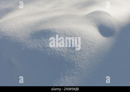 A snow covered surface of relief Stock Photo