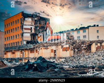 Making Way for Progress. Yellow Excavator Clears Path for New Development with Demolition of Concrete Structures. Stock Photo
