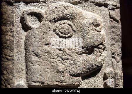 Block of carved stone with relief from Mexica culture showing the date '13 Jaguar', one of the days in the 260-day ritual calendar Tonalpohualli. Stock Photo