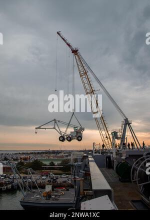 A crane lifts the first-in-class aircraft carrier USS Gerald R. Ford’s ...