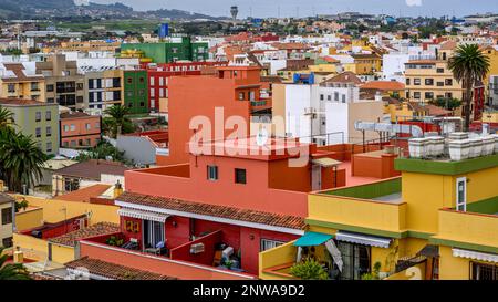 Vibrant apartment blocks fill the view over San Cristobal de La Laguna towards Tenerife North Airport. Stock Photo